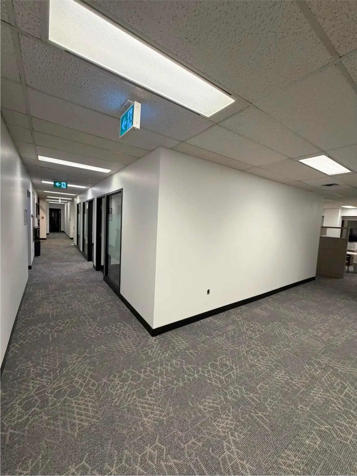 Office corridor with new grey carpet tile flooring
